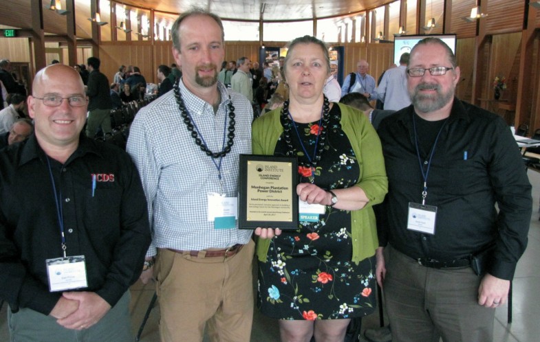 Marian Chioffi and Chris Smith of the Monhegan Plantation Power District (center) were joined by representatives of Innovative Construction & Design Solutions, LLC after receiving the Island Energy Innovation Award at the 2017 Island Energy Conference