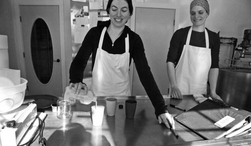 Rachel Bell offers up a sample of kefir, a fermented beverage made from milk. Kefir sales have increased 500 percent this past year.