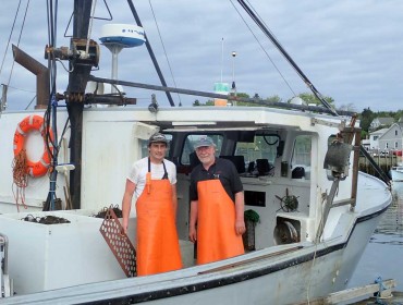 Marsden Brewer, right, with his son Bob aboard his 38-foot fishing boat Lindsay Marie.