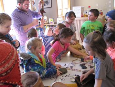 Students examine native artifacts