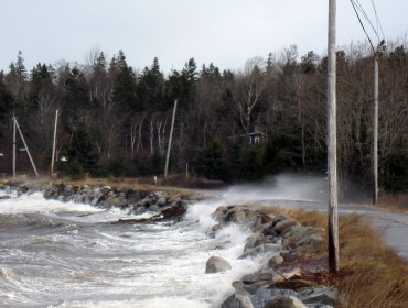 Waves batter a road on Islesboro. PHOTO: COURTESY DOUG WELLDON