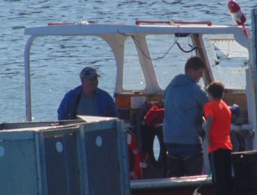 Ryan Murphy hands out cards explaining how to turn on the Libby Island fog horn.