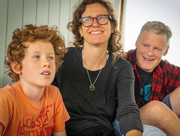 John Roos with his wife and son.