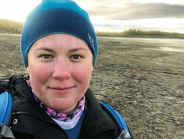 Jacquelyn Gill stands near the Indigirka River, Belaya Gora, Sakha Republic, Russia. PHOTO: COURTESY UNIVERSITY OF MAINE