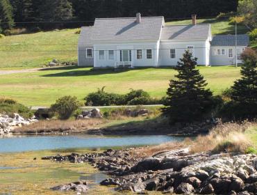 old Cape Cod house on Isle au Haut shore