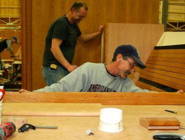 Workers finish a boat at Hinckley