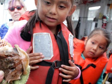 Hispanic children learn about fishing