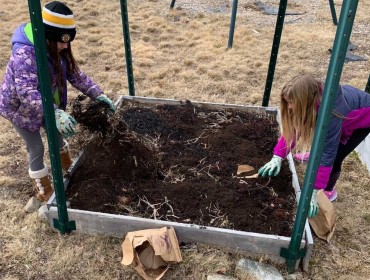 tudents on Frenchboro add soil amendments to their garden plot. PHOTO: COURTESY LAURA VENGER