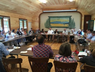 State and community leaders take part in a roundtable discussion about broadband in Maine following a ribbon cutting on the Cranberry Isles in July.