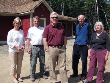 From left, outside the new facility, are: Kerry Claflin, Larry Wonson, Bruce Claflin, Arch Gillies, and Nancy Wuori.