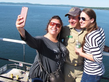 Rylee Knox, center, takes a "selfie" with his mother and girlfriend.