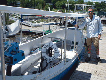 Channing Boswell at the dock off Thompson Wharf in Belfast, where he operates an electric-powered tour boat.