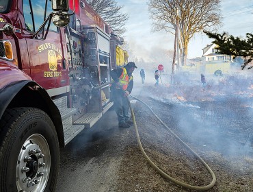 Volunteers burn fields on Swan's Island