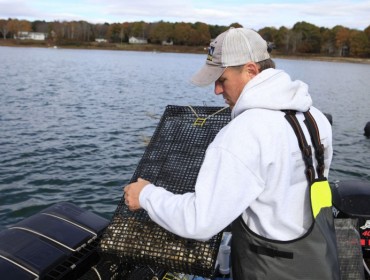 Chebeague fishermen and former ABD participant Jeff Putnam works on oyster cages. After going through the program in 2016, Putnam started an oyster-growing business with his family.