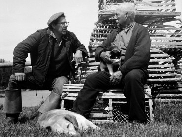 Fisherman George Curtis and retired fisherman William Leaman talk fishing (of course) outside of Leaman’s fish house in Owls Head in 1957. 