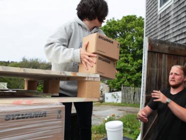 unloading LED bulbs on Monhegan