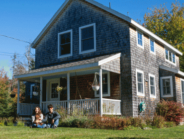 The author and her husband, Bill Trevaskis, in front of their home on North Haven.