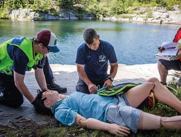 Working with a mannequin at one of Vinalhaven's quarries.