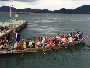 COA students try their hand at rowing a "dragon" boat.