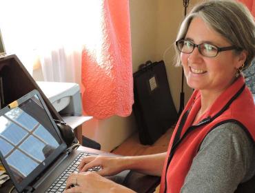 Lora Whelan, working at home in Eastport.