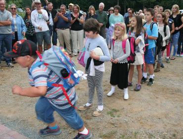 A student runs into Longfellow school.