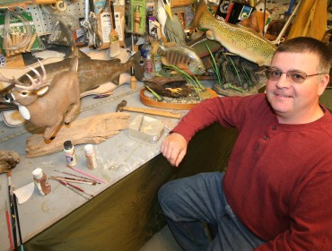 Joe McBrine with his carving work.