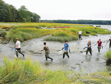 Brunswick High School  Marine Biology students test our their waders on their first day at the outdoor classroom on Maquoit Bay.