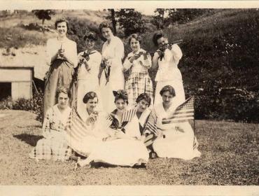 Women posing with guns