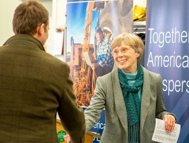 Arrowsic's Sukey Heard greets the Island Institute's Nick Battista.