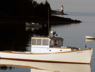 Lobster boat and lighthouse