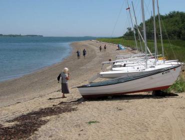 Sailboats and people on Chebeague Island shore