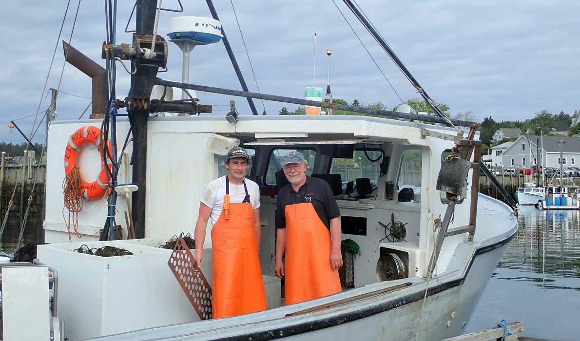 Marsden Brewer, right, with his son Bob aboard his 38-foot fishing boat Lindsay Marie.