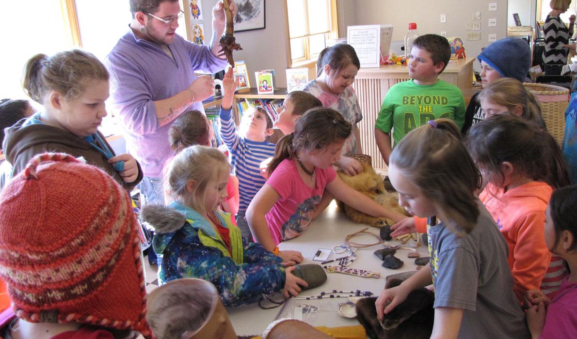 Students examine native artifacts