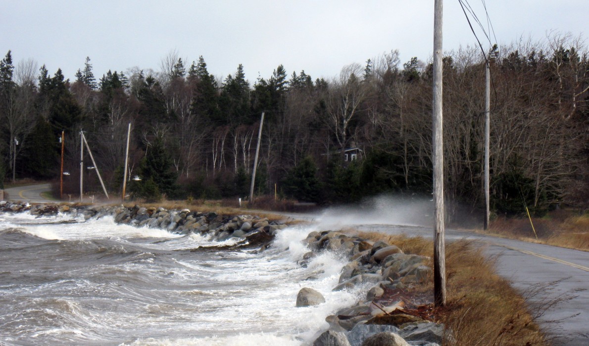 Waves batter a road on Islesboro. PHOTO: COURTESY DOUG WELLDON