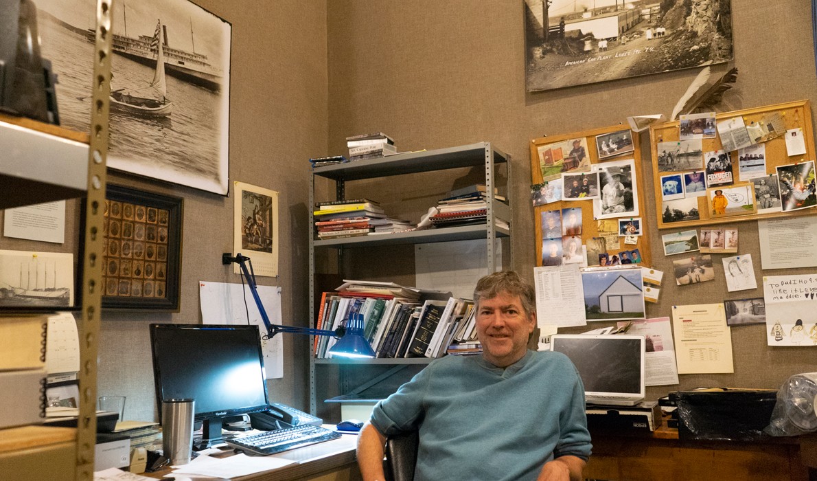 Kevin Johnson, photo archivist at Searsport’s Penobscot Marine Museum, at his work station where he and others digitize old photographs. PHOTO: TOM GROENING