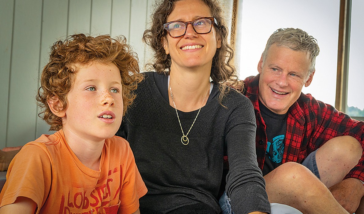 John Roos with his wife and son.