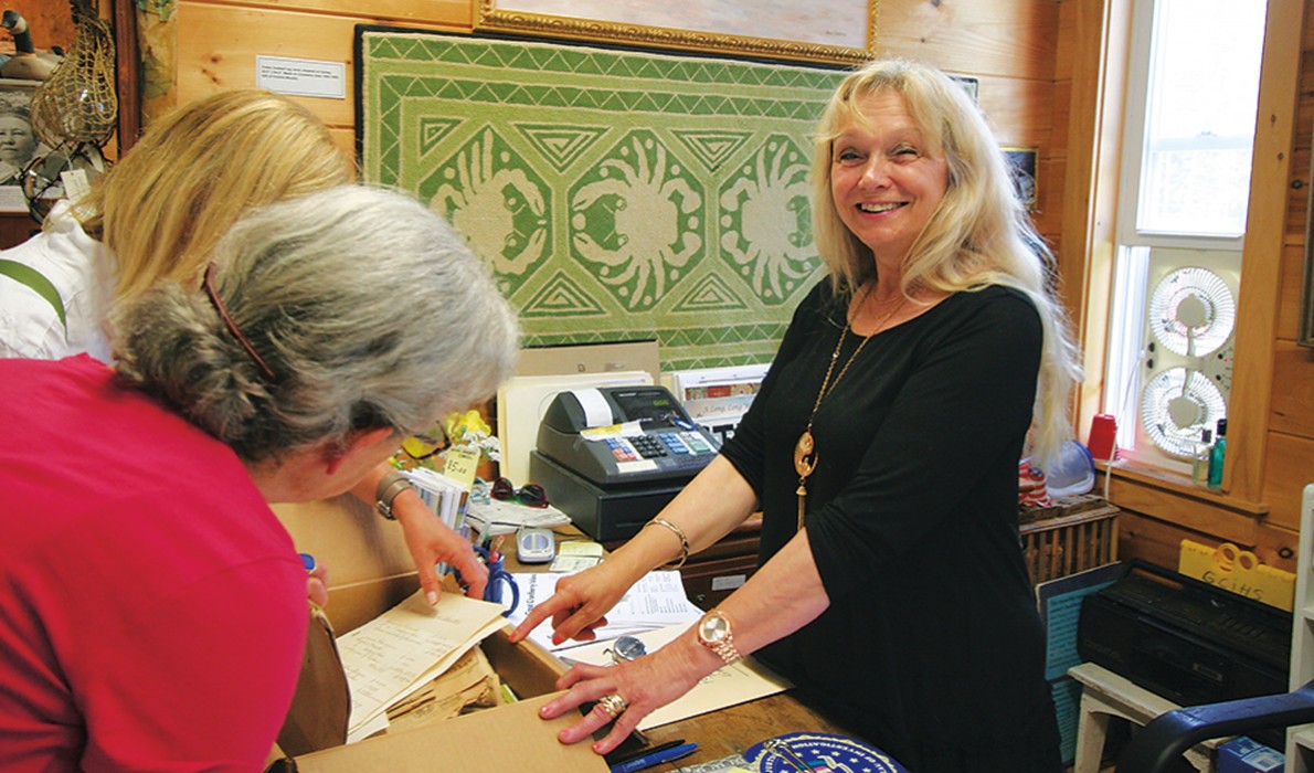 Karin Whitney, right, works at the Preble-Marr Historical Museum, part of Cranberry House, a community hub.