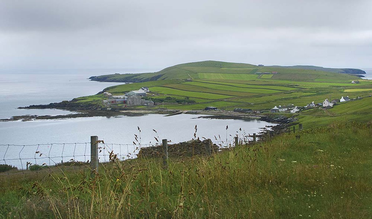 A scenic view of an island off Scotland.