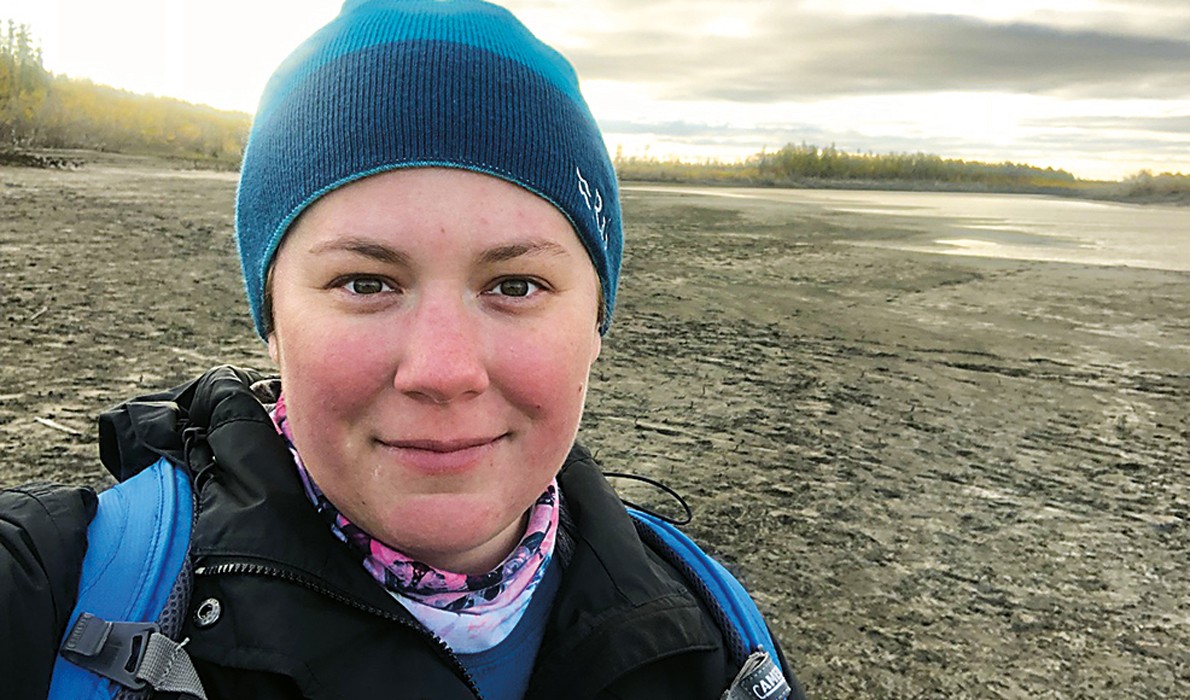 Jacquelyn Gill stands near the Indigirka River, Belaya Gora, Sakha Republic, Russia. PHOTO: COURTESY UNIVERSITY OF MAINE