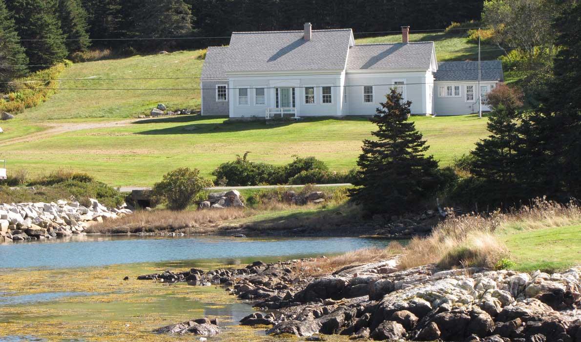 old Cape Cod house on Isle au Haut shore