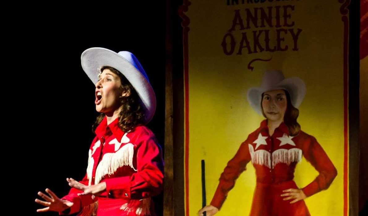 Courtney Naliboff as Annie Oakley.