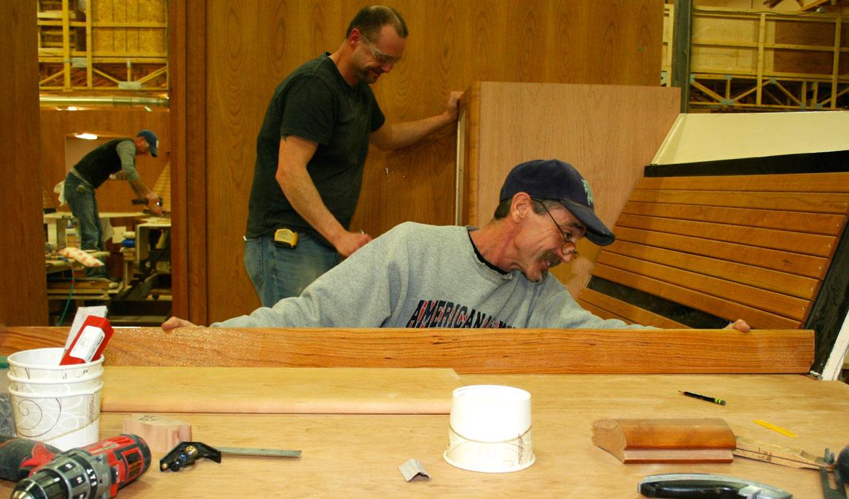 Workers finish a boat at Hinckley