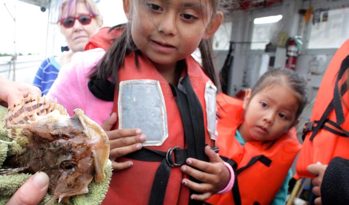 Hispanic children learn about fishing