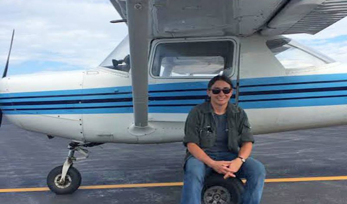 Eva Murray poses with her plane.