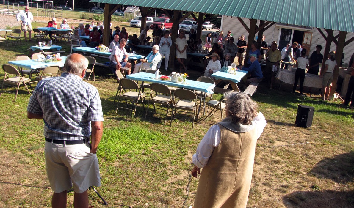 Jim Van Fleet, left, and Leila Bisharat address Chebeague islanders at a picnic on Aug. 6.