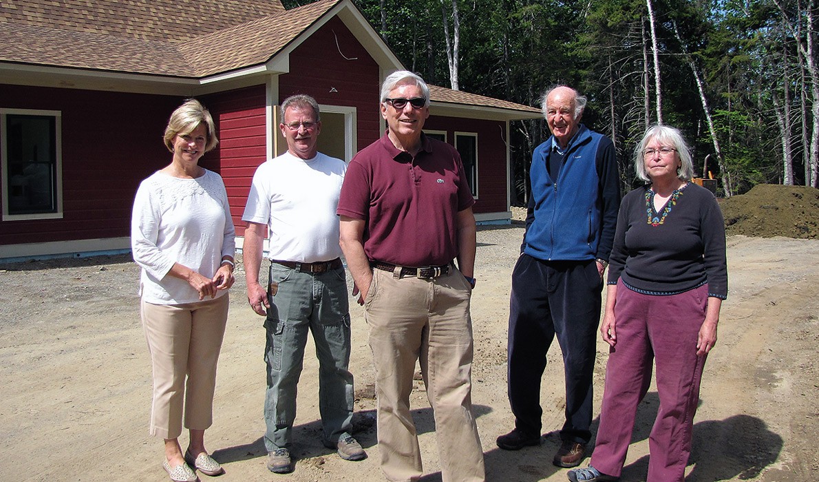 From left, outside the new facility, are: Kerry Claflin, Larry Wonson, Bruce Claflin, Arch Gillies, and Nancy Wuori.