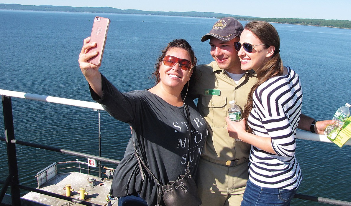 Rylee Knox, center, takes a "selfie" with his mother and girlfriend.