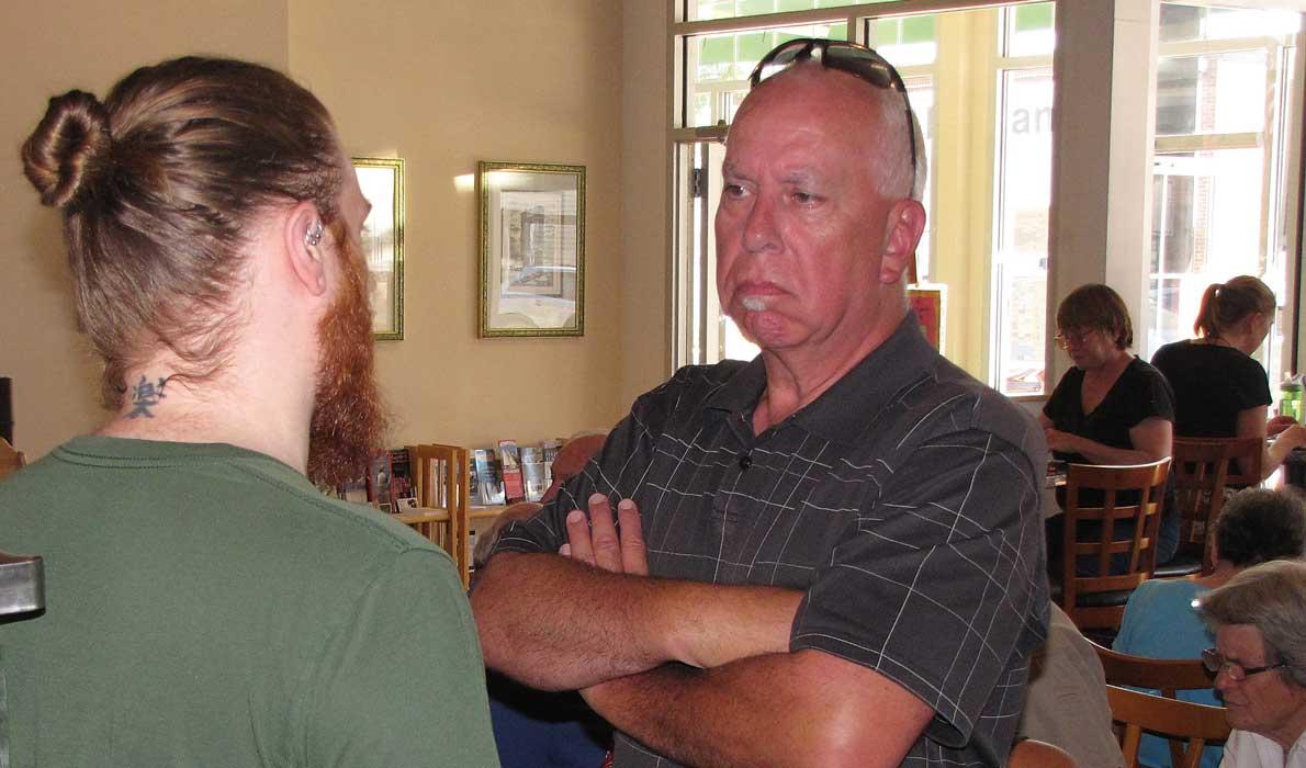 Gordon Page chats with the manager of Rock City Café.