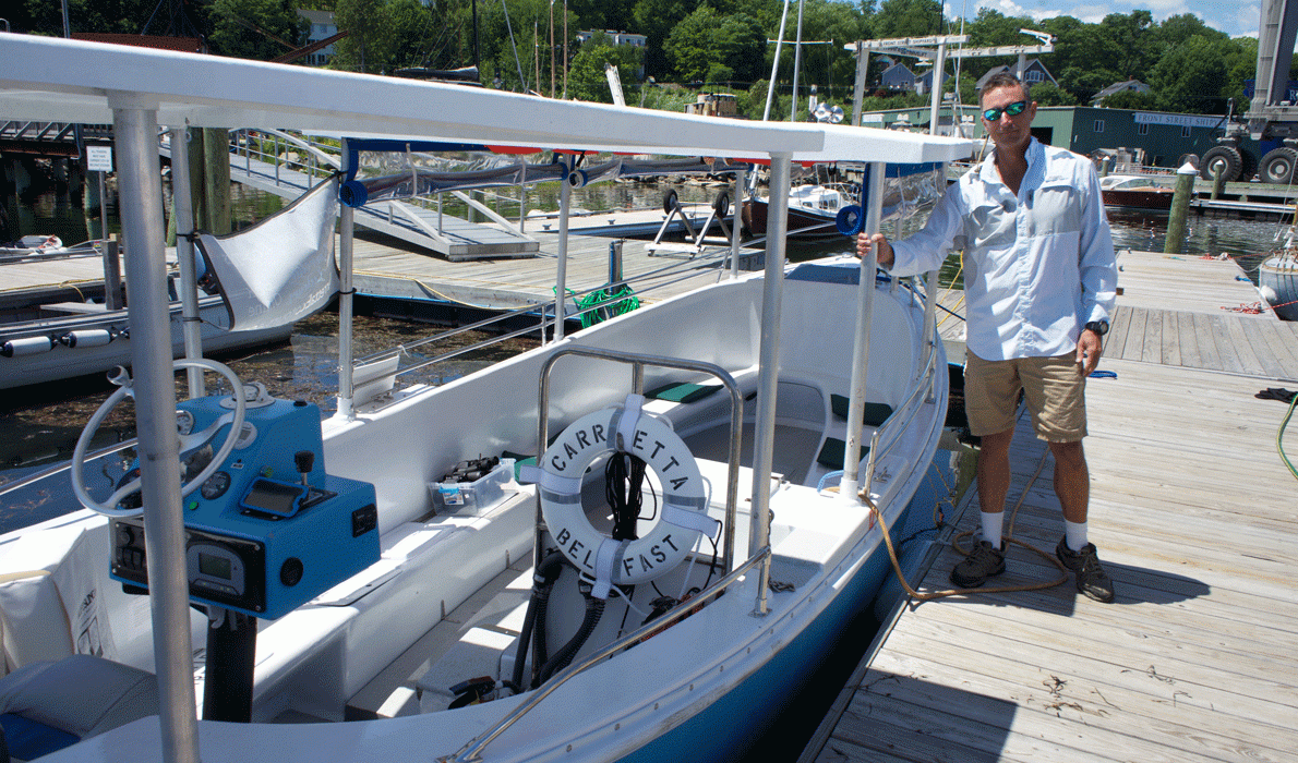 Channing Boswell at the dock off Thompson Wharf in Belfast, where he operates an electric-powered tour boat.