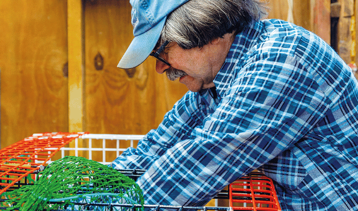 Donnie Carlson builds a lobster trap.